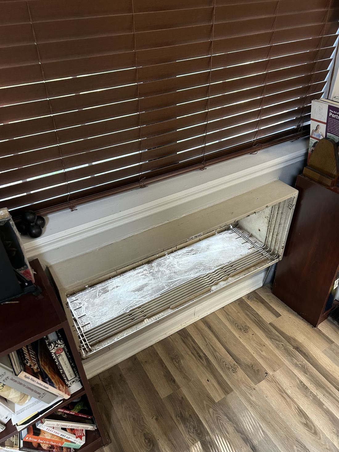 Old, worn indoor AC unit before Engle Heating & Air replacement